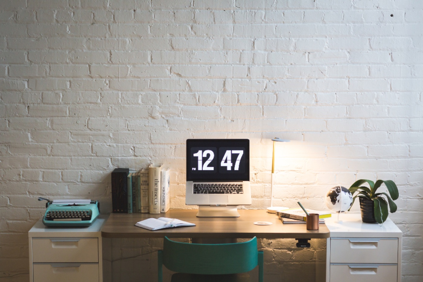 A digital alarm clock on a nightstand reading 11:11 in soft glowing numerals.