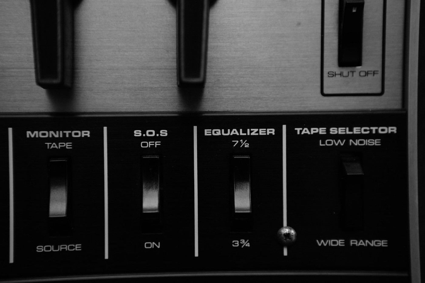 An audio equalizer glowing in violet and gold against a dark background.