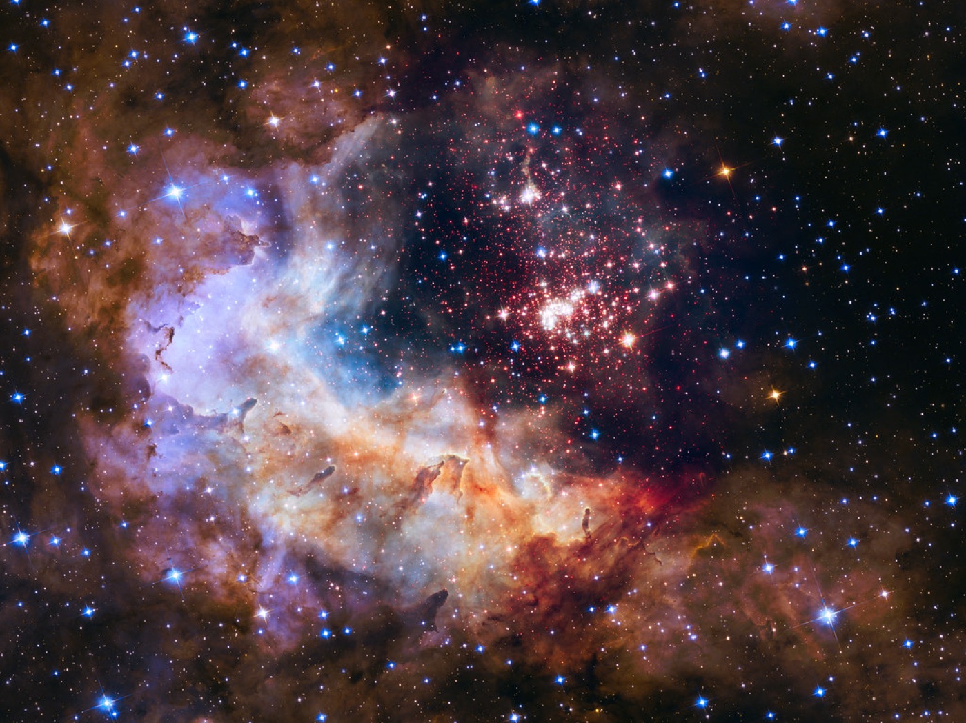 A colorful nebula with a bright point of light at its heart.
