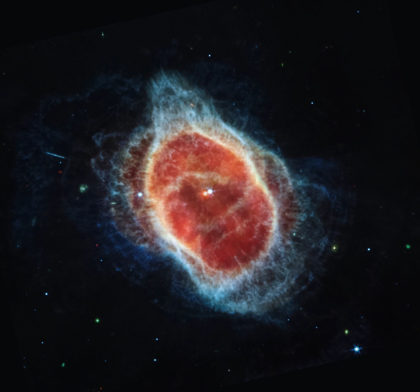 A spiral galaxy glowing against a deep black sky.